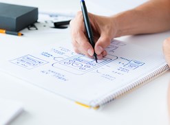 A mobile app developer draws out a plan for a new app