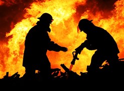 Firefighters work to put out a fire