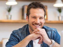 Man smiles creepily