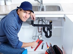 A plumber gets down and dirty