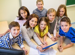 A speech pathologist works with a group of young children