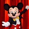 Mickey Mouse in front of a red curtain